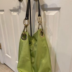 JPK lime green tote with leather strap and oversized gold medal detail